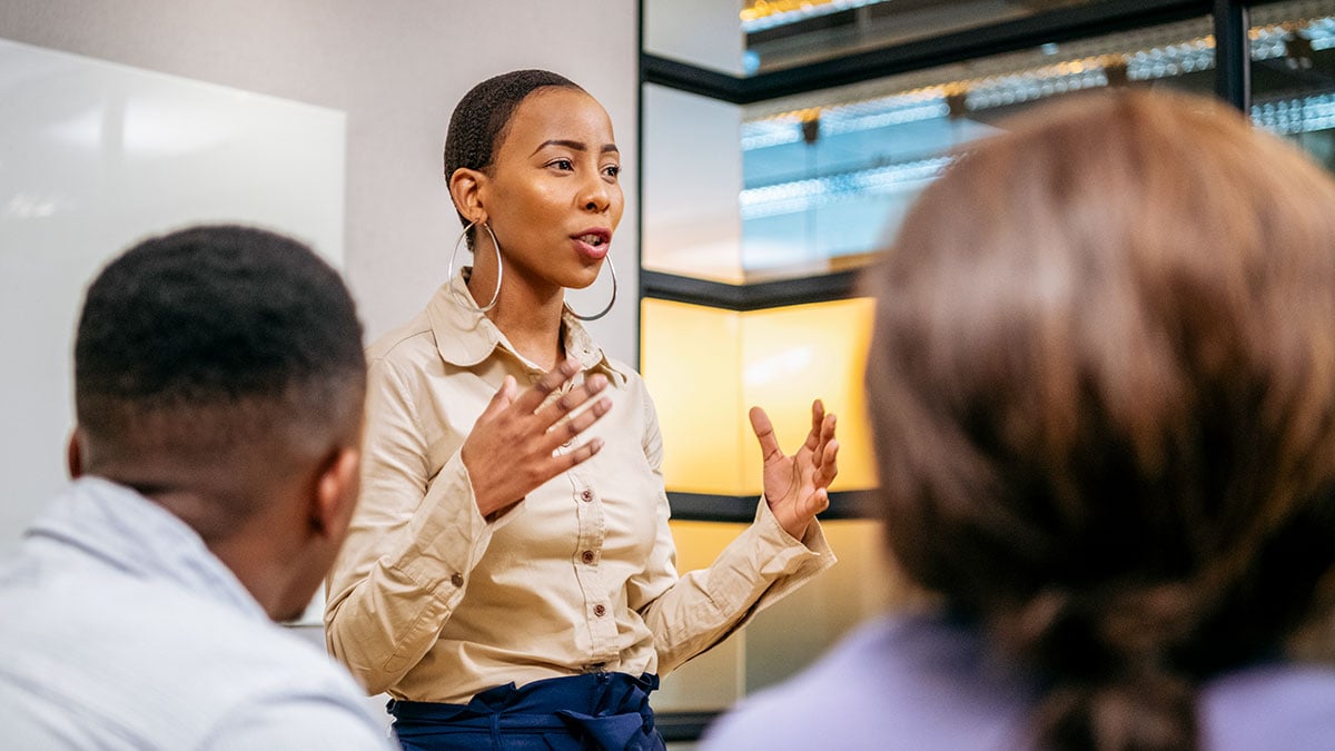 Young Black businesswoman speaking to a group